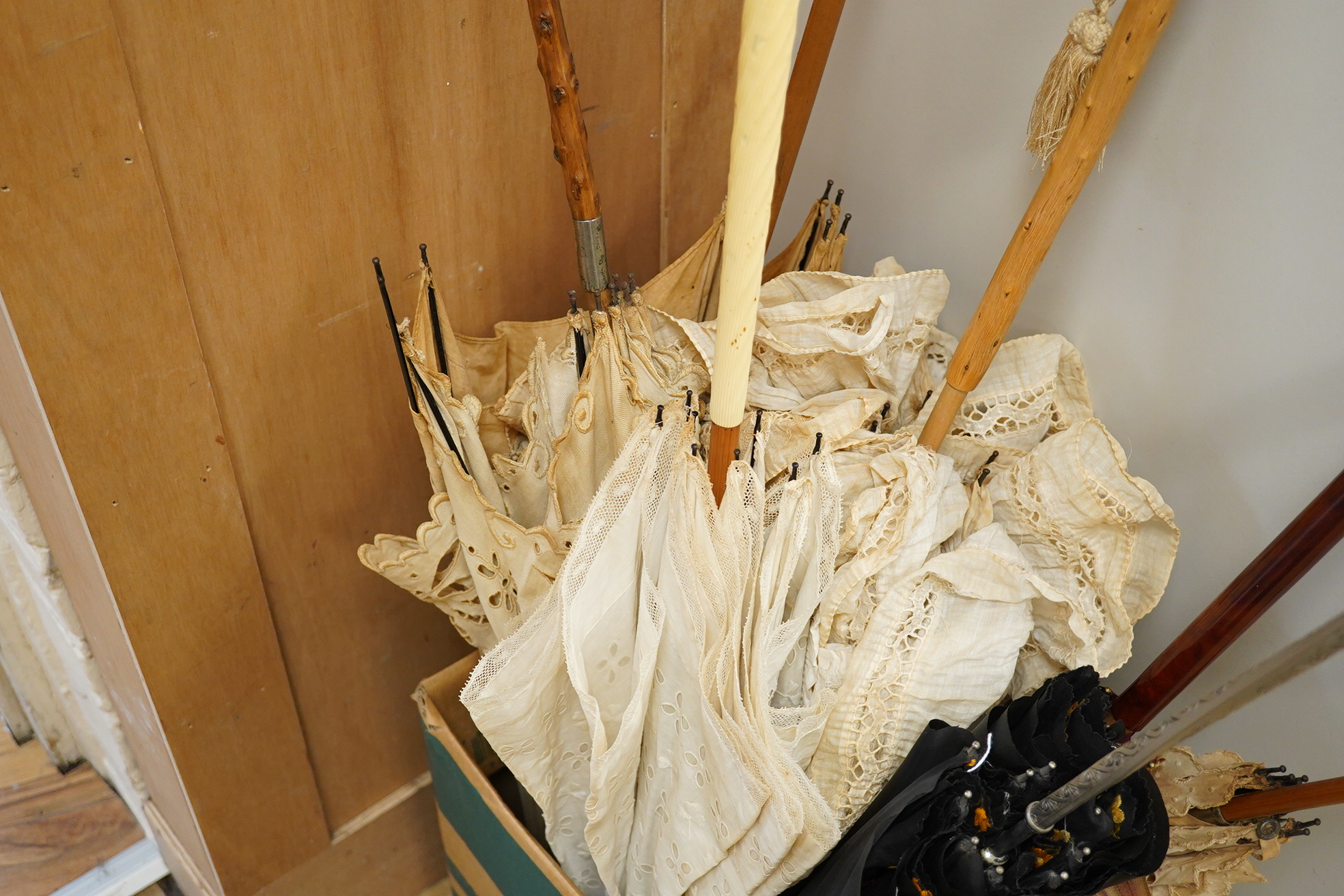 Five early 20th century mixed linen/embroidery anglaise and lace inserted parasols together with two silk parasols, longest 90cm (7). Condition - mostly poor, only undamaged parasol, lace edged with anglaise fabric and f